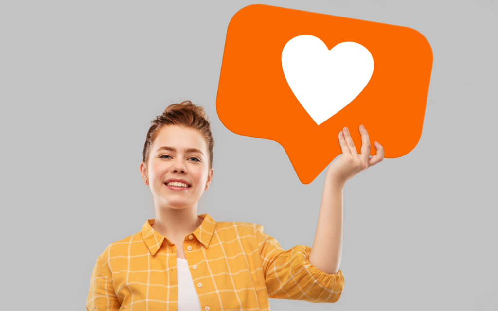 Leçon n°15 de Sacheen, le nombre de likes est un indicateur peu fiable, cette image représente une femme tenant un panneau de like. 